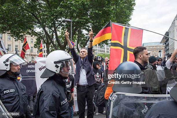 Around 80 Right-wing supporters participate in a demonstration organized by the neo-Nazi "Widerstand Ost-West" group on June 20, 2015 in Frankfurt,...