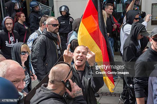 Right-wing supporters participate in a demonstration organized by the neo-Nazi "Widerstand Ost-West" group on June 20, 2015 in Frankfurt, Germany. An...