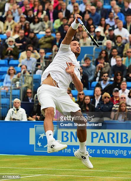 Viktor Troicki of Serbia smashes in his men's singles semi-final match against Andy Murray of Great Britain during day six of the Aegon Championships...