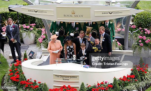 Queen Elizabeth II prsents the Diamond Jubilee Stakes with winning jockey Frankie Dettori and trainer of Undrafted Wesley A. Ward during day 5 of...