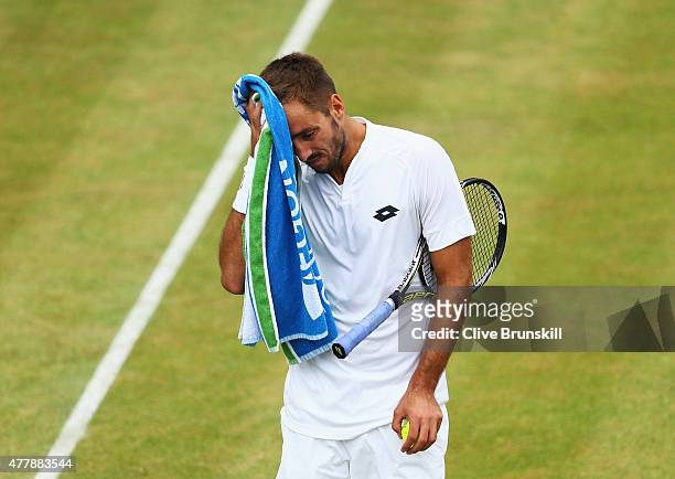 Viktor Troicki of Serbia looks dejected in his men's singles semi-final match against Andy Murray of Great Britain during day six of the Aegon...