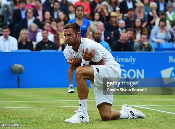 Viktor Troicki of Serbia grimaces after a fall in his men's singles semi-final match against Andy Murray of Great Britain during day six of the Aegon...