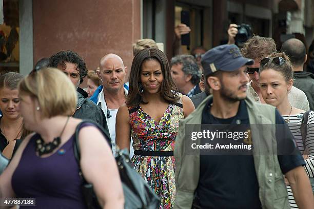 First Lady Michelle Obama walks along a canal in Murano on June 20, 2015 in Venice, Italy. Michelle Obama has travelled to Italy where she is...
