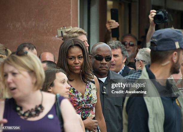 First Lady Michelle Obama walks along a canal in Murano on June 20, 2015 in Venice, Italy. Michelle Obama has travelled to Italy where she is...