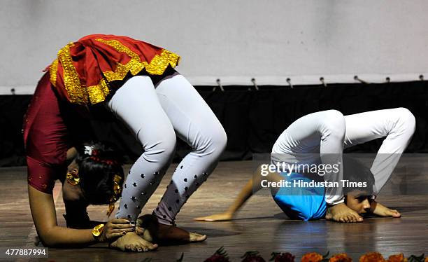 Boys and girls performing Yoga on the eve of the 'International Yoga Day Celebration' at North Kolkata on June 20, 2015 in Kolkata, India. On June...