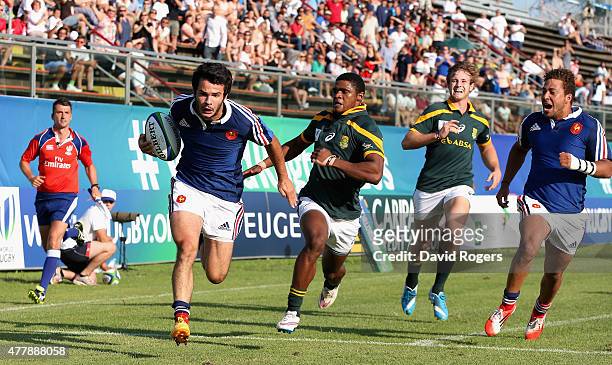Arthur Bonneval of France races away from Warrick Gelant to score the first try during the World Rugby U20 Championship 3rd Place Play-Off match...