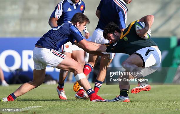 Damian Penaud of France holds onto EW Viljoen during the World Rugby U20 Championship 3rd Place Play-Off match between France and South Africa at...