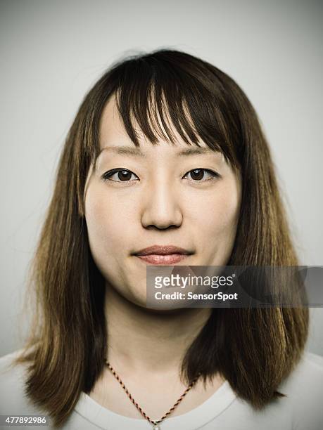 portrait of a young japanese woman looking at camera - girl mugshots stock pictures, royalty-free photos & images