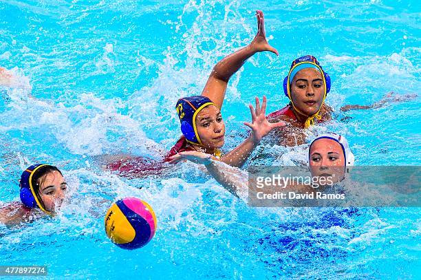 Polina Kempf of Russia vies for the ball with Mireia Guiral Anna Roldan and Paula Crespi of Spain in the Women's Waterpolo Final during day eight of...