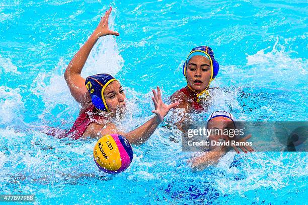 Polina Kempf of Russia vies for the ball with Anna Roldan and Paula Crespi of Spain in the Women's Waterpolo Final during day eight of the Baku 2015...
