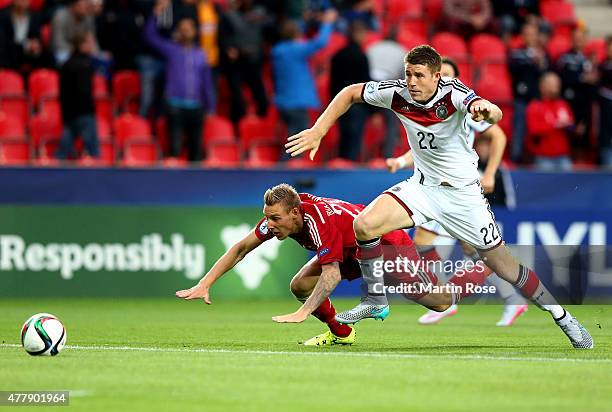 Dominique Heintz of Germany and Nicolai Brock Madsen of Denmark battle for the ball during the UEFA European Under-21 Group A match between Germany...