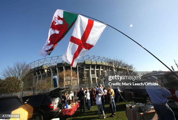 Fans in the Twickenham car park flying English and Welsh flags prior to the RBS Six Nations match between England and Wales at Twickenham Stadium on...