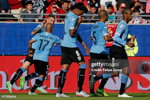 Jose Maria Gimenez of Uruguay celebrates with teammates after scoring the opening goal during the 2015 Copa America Chile Group B match between...