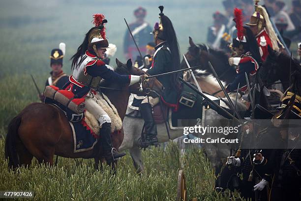 Historical re-enactors take part in the second part of a large scale re-enactment of the battle of Waterloo, to mark it's bicentenary on June 20,...