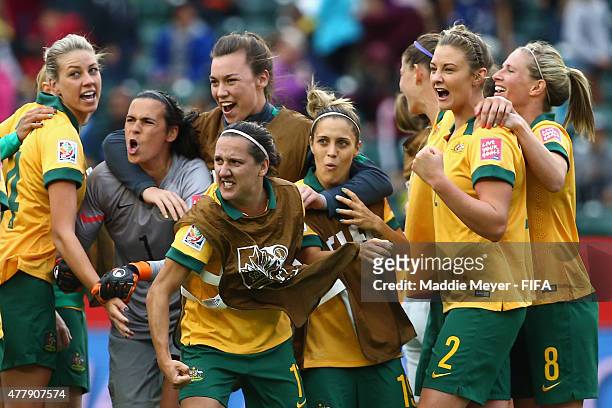 Australia celebrates, led by Lisa De Vanna of Australia, center, after their 1-1 tie against Sweden during the Women's World Cup 2015 Group D match...