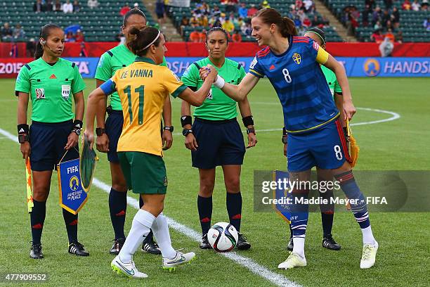 Lotta Schelin of Sweden and Lisa De Vanna of Australia shake hands before their Women's World Cup 2015 Group B match at Commonwealth Stadium on June...