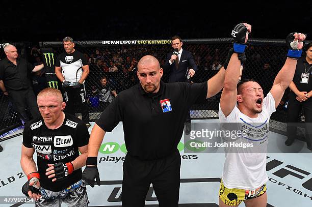 Tatsuya Kawajiri of Japan celebrates after defeating Dennis Siver in their featherweight bout during the UFC Fight Night event at the O2 World on...