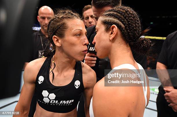 Joanna Jedrzejczyk of Poland and Jessica Penne of the United States face off before their women's strawweight championship bout during the UFC Fight...