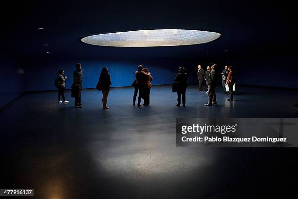 People visit the memorial monument for the victims of Madrid train bombings at Atocha railway station during the 10th anniversary on March 11, 2014...