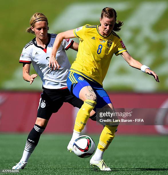 Saskia Bartusiak of Germany challenges Lotta Schelin of Sweden during the FIFA Women's World Cup 2015 Round of 16 match between Germany and Sweden at...