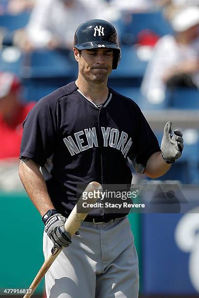 Scott Sizemore of the New York Yankees reacts to striking out against the Washington Nationals in the second inning of a game at the Space Coast...