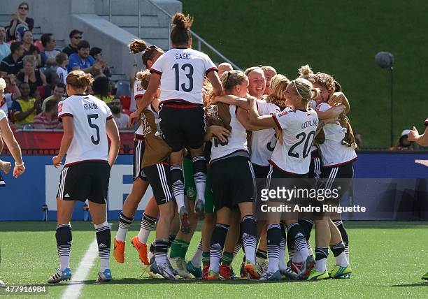 Celia Sasic of Germany jumps to celebrate the first goal of the game with team mates during the FIFA Women's World Cup Canada 2015 round of 16 match...