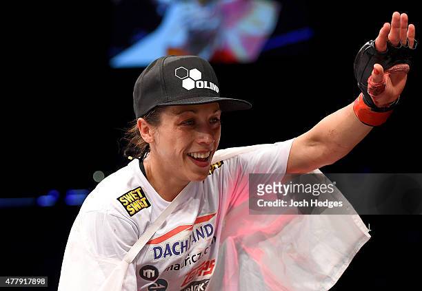 Women's strawweight champion Joanna Jedrzejczyk of Poland celebrates after defeating Jessica Penne of the United States in their women's strawweight...