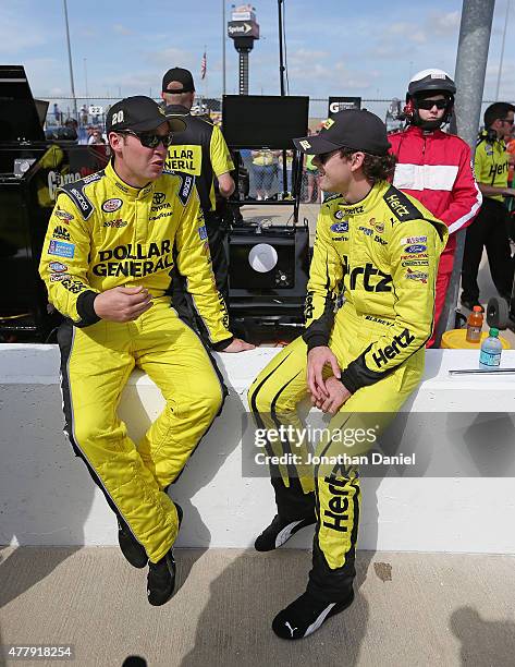 Ross Kenseth, driver of the Dollar General Toyota and Ryan Blaney, driver of the Hertz Ford chat before qualifying for the NASCAR XFINITY Owens...