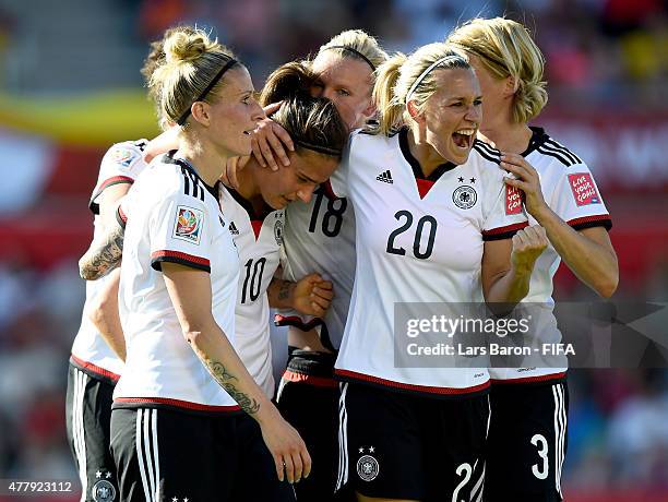 Dzsenifer Marozsan of Germany celebrates with Lena Goessling of Germany and other team mates after scoring her teams fourth goal during the FIFA...