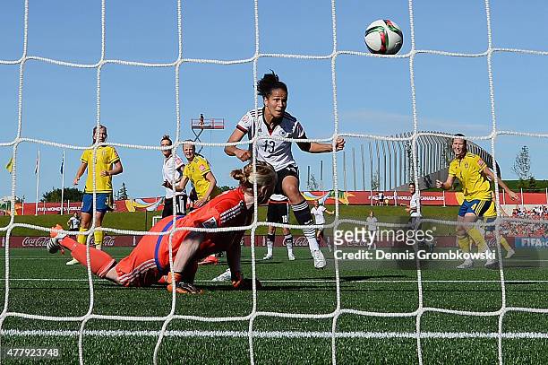 Celia Sasic of Germany scores the third goal past goalkeeper Hedvig Lindahl of Sweden during the FIFA Women's World Cup Canada 2015 Round of 16 match...