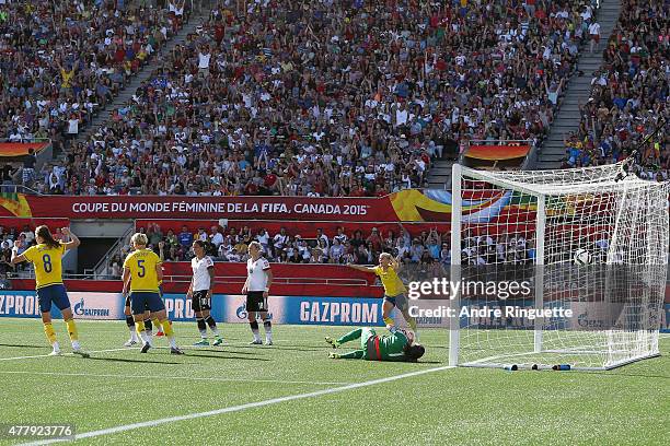 Lotta Schelin, Nilla Fischer and Sofia Jakobsson of Sweden celebrate their first goal of the game against Germany during the FIFA Women's World Cup...