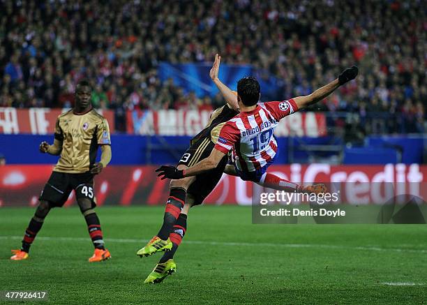 Diego Costa of Club Atletico de Madrid clashes with Adil Rami of AC Milan during the UEFA Champions League Round of 16, 2nd leg match between Club...