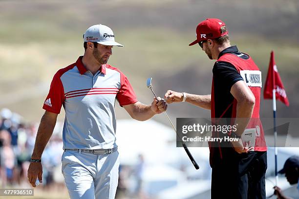 Dustin Johnson of the United States celebrates with his brother/caddie Austin Johnson after a birdie on the fifth hole during the third round of the...