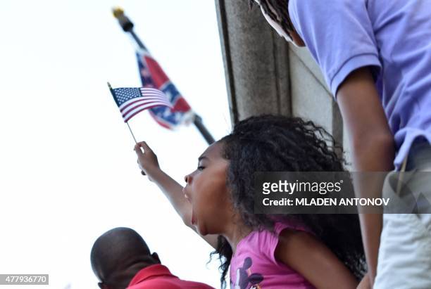 Young girl shouts slogans as hundreds of people gather for a protest rally against the Confederate flag in Columbia, South Carolina on June 20, 2015....
