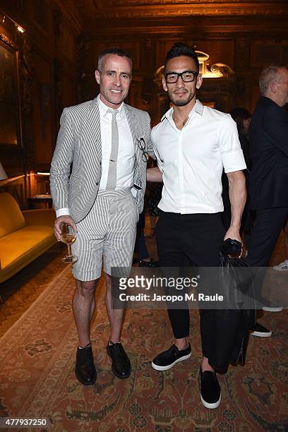 Thom Browne and Hidetoshi Nakata attend GQ Party for Jim Moore during Milan Menswear Fashion Week Spring/Summer 2016 at Casa Degli Atellani on June...