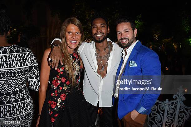 Anna Dello Russo and Miguel attend GQ Party for Jim Moore during Milan Menswear Fashion Week Spring/Summer 2016 at Casa Degli Atellani on June 20,...