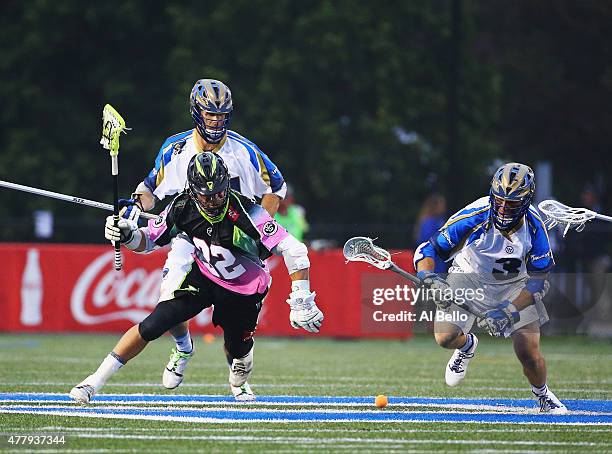 Greg Gurenlian of New York Lizards and Brendan Fowler of Charlotte Hounds battle for the ball during their game at James M. Shuart Stadium on June...