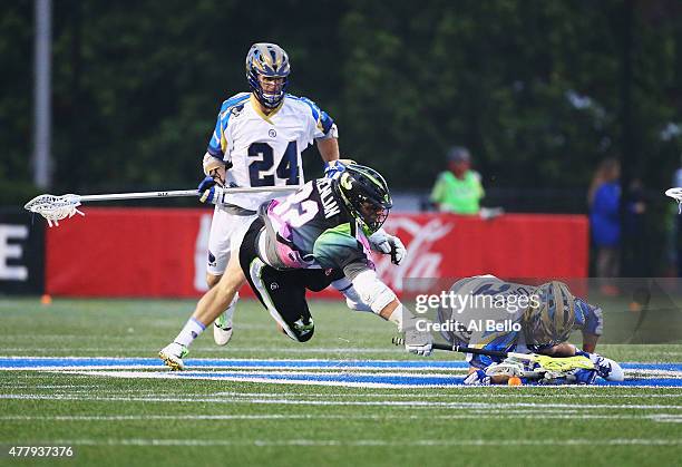 Greg Gurenlian of New York Lizards and Brendan Fowler of Charlotte Hounds battle for the ball during their game at James M. Shuart Stadium on June...