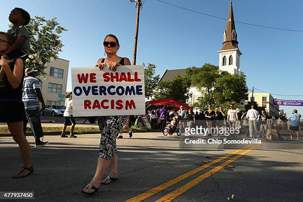 More than 1,000 people participate in the March for Black Lives and walk silently past the historic Emanuel African Methodist Church where nine...