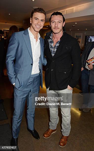 Richard Fleeshman and Luke Evans attend the press night performance of "Urinetown" at the St James Theatre on March 11, 2014 in London, England.