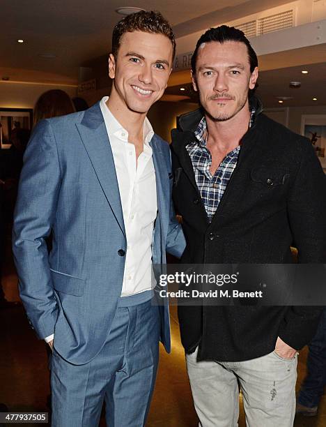 Richard Fleeshman and Luke Evans attend the press night performance of "Urinetown" at the St James Theatre on March 11, 2014 in London, England.