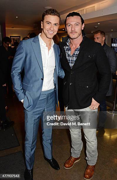 Richard Fleeshman and Luke Evans attend the press night performance of "Urinetown" at the St James Theatre on March 11, 2014 in London, England.