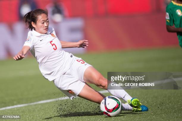 China's Wu Haiyan stops the ball behind her goalkeeper during their 2015 FIFA Women's World Cup football Group of 16 match between Cameroon and China...