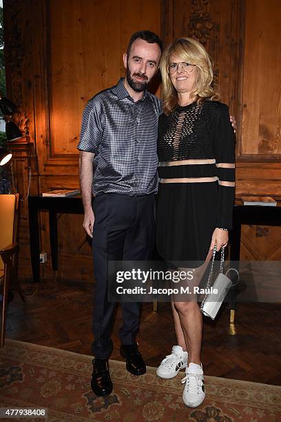 Brendan Mullane and Madeline Weeks attend GQ Party for Jim Moore during Milan Menswear Fashion Week Spring/Summer 2016 at Casa Degli Atellani on June...