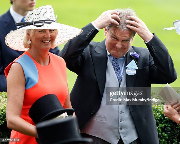 Hugh Bonneville ruffles his hair as he attends day 5 of Royal Ascot at Ascot Racecourse on June 20, 2015 in Ascot, England.
