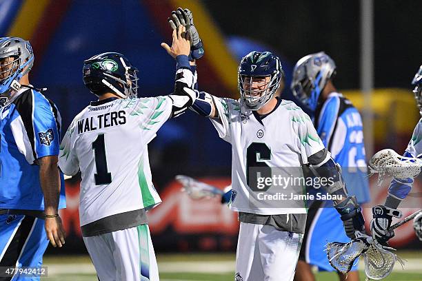 Ben Rubeor of the Chesapeake Bayhawks celebrates with Joe Walters after Rubeor scored the game-winning goal in overtime against the Ohio Machine on...