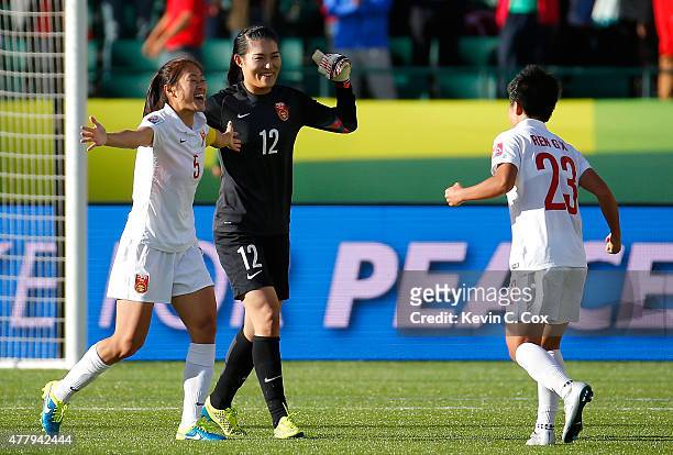 Goalkeeper Wang Fei, Wu Haiyan and Ren Guixin of China PR celebrate their 1-0 win over Cameroon in the FIFA Women's World Canada 2015 Round of 16...