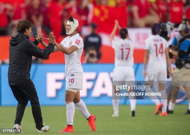 China's Han Peng celebrates their 1-0 victory over Cameroon after their 2015 FIFA Women's World Cup football Group of 16 match at Commonwealth...