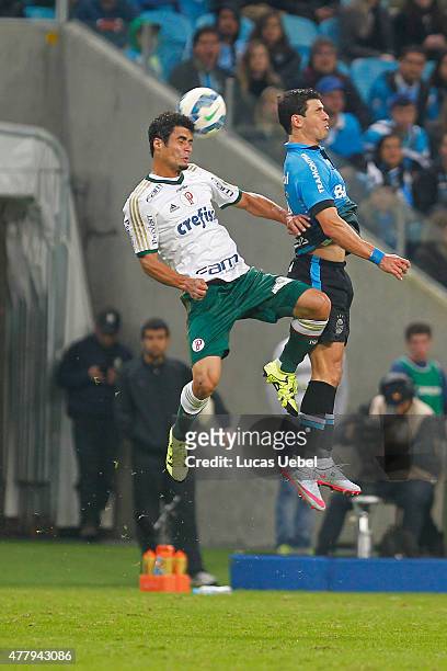 Giuliano of Gremio battles for the ball against Egidio of Palmeiras during the match Gremio v Palmeiras as part of Brasileirao Series A 2015, at...