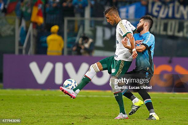 Marcelo Oliveira of Gremio battles for the ball against Rafael Marques of Palmeiras during the match Gremio v Palmeiras as part of Brasileirao Series...